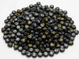 Cuentas plasticas pastilla negra letra blanca 